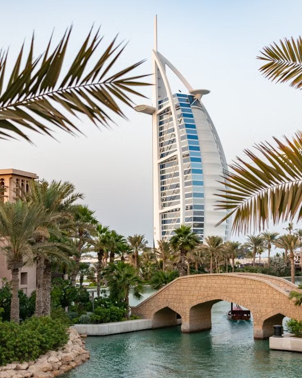 Burj Al Arab framed by palm fronds in Madinat Jumeirah, Dubai